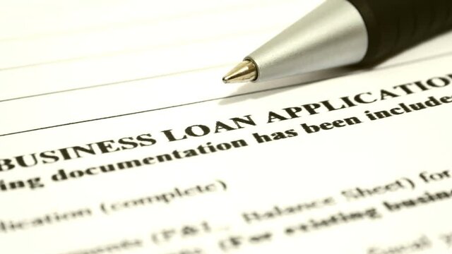 Close up of business loan application dolly shot