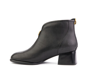 Women's autumn ankle black leather boots with black zip and average heels, isolated white background. Left side view. Fashion shoes. Photoshoot for shoe shop concept.