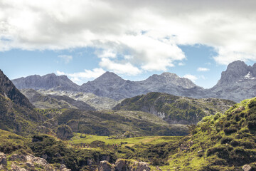 Fototapeta na wymiar Landscape of the mountains of Picos de Europa, Asturias, Spain. Blue sky and some white clouds
