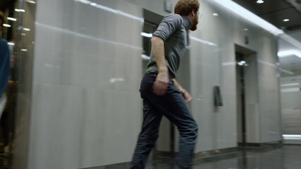 Business people standing in elevator car. Businessman running out of elevator 