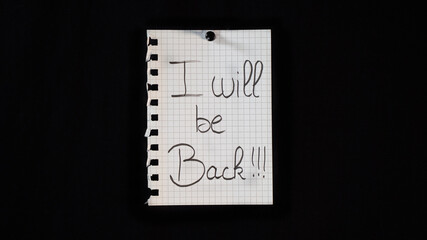 Hand written message on a ripped notebook sheet, 