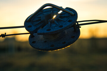 fence clamp central set in sunset with light rays