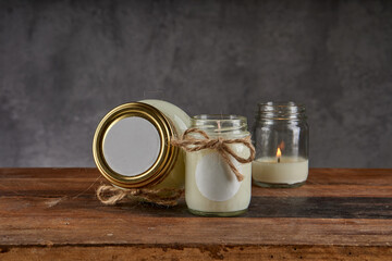 Beauty spa treatment and relaxation concept. candle for relaxing spa massage and body and face on a wooden table and gray background. horizontal and copy space