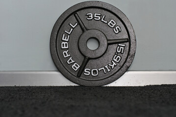 Olympic thirty-five pound weight platter.