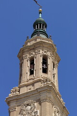 Fototapeta premium Detail of a tower of the Cathedral Basilica of Nuestra Señora del Pilar in Zaragoza, Aragon, Spain. Vertical image.