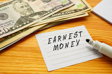 Business concept about EARNEST MONEY with phrase on the sheet.