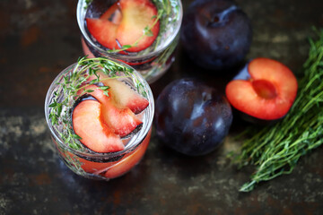 Detox drink with thyme and plums.