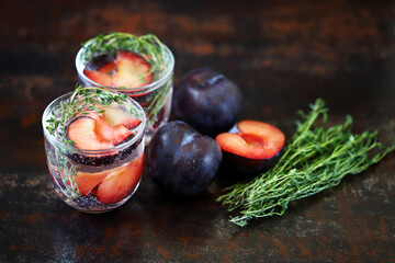 Detox drink with thyme and plums.