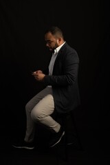 portrait of a man looking to his iPhone