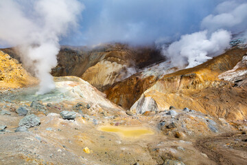 Beautiful volcanic landscape, crater of active volcano: hot spring, fumarole, lava field, gas-steam...