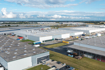 Aerial view of large warehouse. Logistics center in industrial city zone from above.
