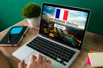 Young man studying french online