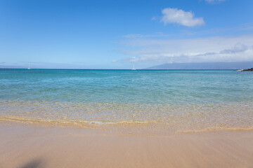 Fototapeta na wymiar Wave on sand close up in tropical beach. Ocean water background 