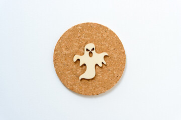 isolated retro halloween wooden shape (ghost) on cork with space