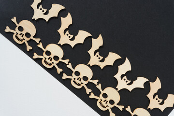 laser cut wooden shapes arranged in a row on a geometric paper background - halloween or pirate...