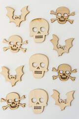 retro halloween wooden shapes (skulls, skull and crossbones, and bats) on white