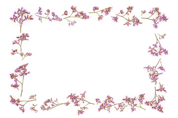 Obraz na płótnie Canvas Composition pattern from plants, pink wild flowers, isolated on white background, flat lay, top view. The concept of summer, spring, floral frame with copy space for text