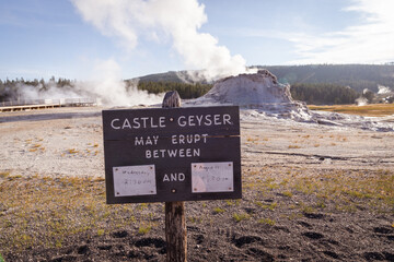 Sign for Castle Geyser eruption times in Yellowstone National Park