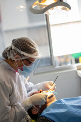 Obraz na płótnie Canvas a dentist at work, at the dentist, oral health