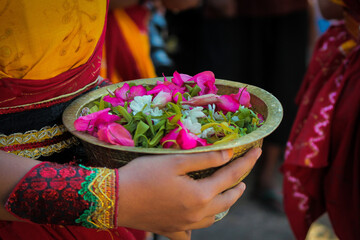 Girl carrying flowers