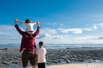 Fototapeta premium child riding his dad's neck, family time, father's day 