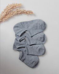 Plain gray socks for men and women. Socks are usually used to protect the feet from direct friction...
