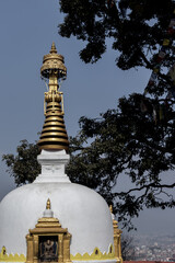 Small stupa and statue of Buddha at Swayambhunath, Kathmandu, Nepal