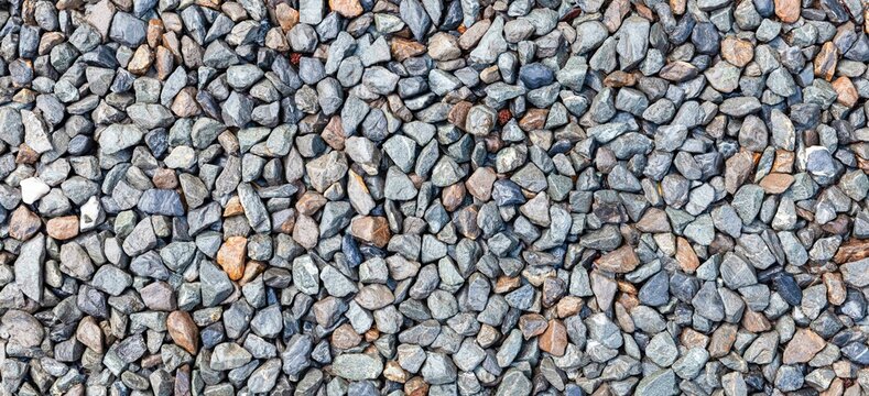Panorama of Multi-colored pebbles floor pattern and background seamless