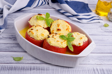 Stewed tomatoes stuffed with cheese