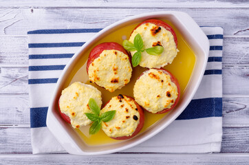 Stewed tomatoes stuffed with cheese