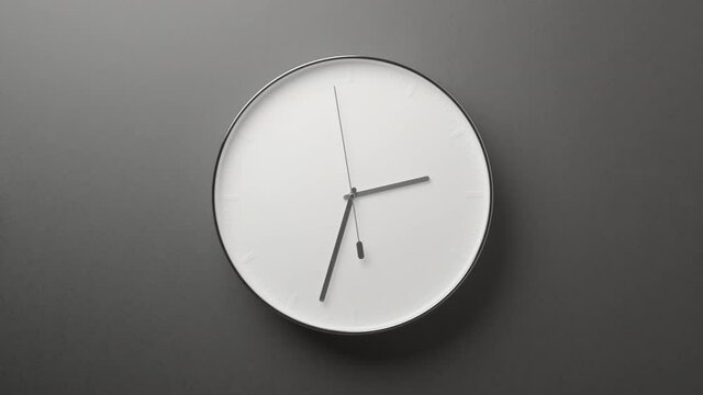 Clock Face on Dark Grey Office Wall in Timelapse