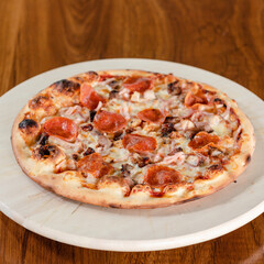 Fresh homemade Italian pizza Margarita with mozzarella and pepperoni 