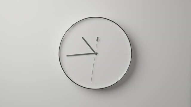 Clock Face on White Office Wall in Timelapse
