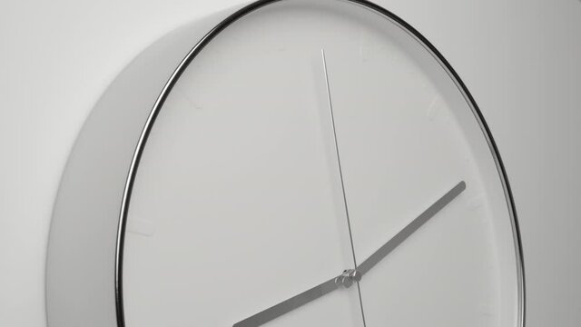 Clock Face on White Office Wall in Timelapse