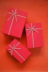 Cristmas presents. Surprises and gifts .  Red boxes set  on a red background.Merry Christmas.