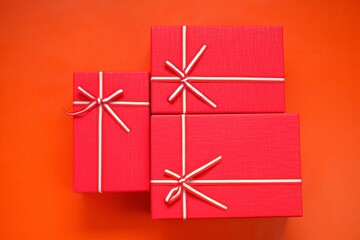 Merry Christmas. Surprises and gifts for the winter holidays.  Red boxes set  on a red background