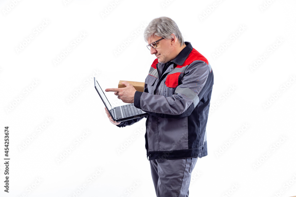 Poster man works in order fulfillment center. concept - it registers the product in database. box and lapto