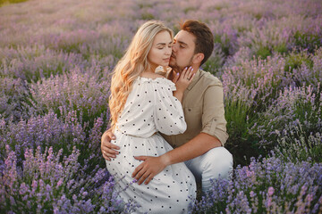 Woman in a white dress with her husband in a lavender field