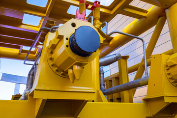 Compressor gas station. Compressor equipment at gas station. Fragment of methane processing plant. Yellow gas equipment. Gasification of enterprise. Gasification equipment close up.