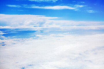 White clouds on blue sky background view from above, airplane flight landscape, beautiful aerial cloudscape, skies backdrop, fluffy cloud texture, sunny heaven, cloudy weather, cloudiness, copy space