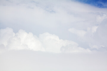 White cumulus clouds blue sky background closeup beautiful aerial cloudscape backdrop, cloudy skies from above, sunny heaven fluffy cloud texture, airplane flight cloudiness landscape view, copy space
