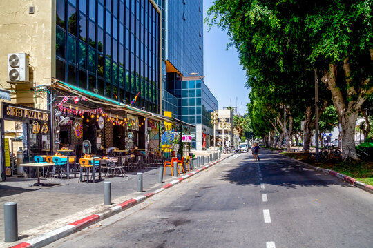 Tel Aviv, Israel - June 27, 2021: on Rothschild Boulevard, one of most important and iconic streets in Tel Aviv. Located in heart of White City of Tel Aviv, Rothschild Boulevard is commercial center.