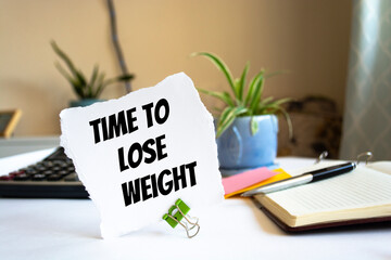 Text time to lose weight on the short note texture background