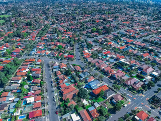 Panoramic Aerial Drone view of Suburban Sydney housing, roof tops, the streets and the parks NSW Australia