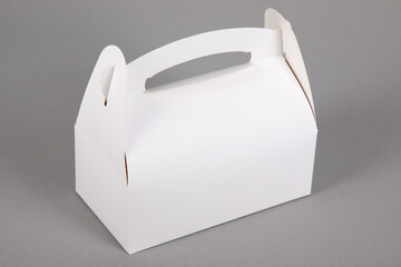 White blank empty mockup paper pastries candies box with handle in grey background