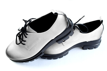 Pair of unisex daily low-soled shoes, isolated.