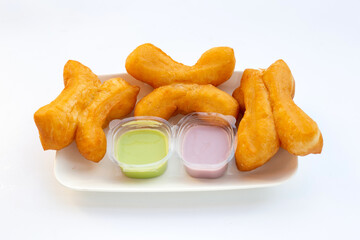 Deep-fried dough sticks or chinese bread sticks on white background.