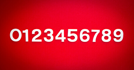 Mathematics background made with solid numbers. Isolated on red