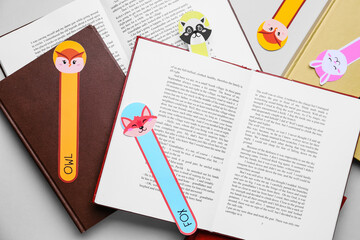 Cute bookmarks with books on light background