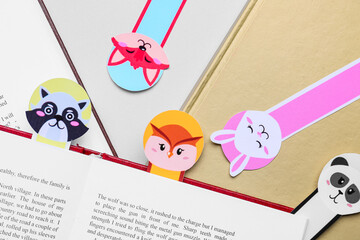 Cute bookmarks with books on light background